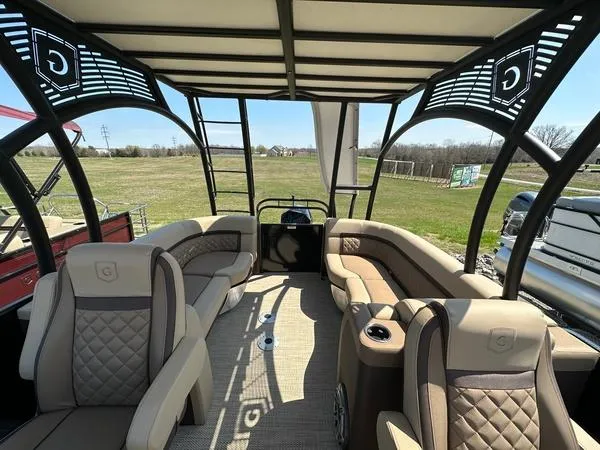 Slide: The Image of 2023 Godfrey Ap255sdc pontoon boat interior with luxurious seating and canopy. - 10