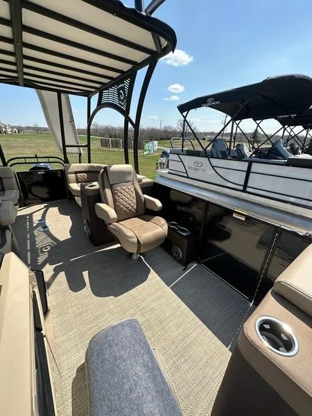 Slide: The Image of 2023 Godfrey Ap255sdc pontoon boat interior with luxurious seating and modern design. - 14