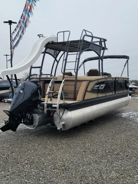 Slide: The Image of 2023 Godfrey Ap255sdc pontoon boat with slide and outboard motor, displayed outdoors. - 2