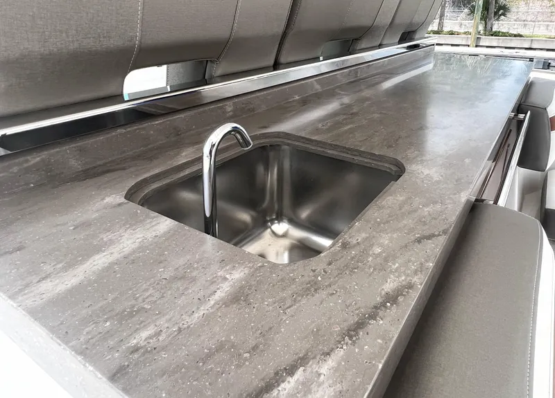 Slide: The Image of 2023 Tiara Yachts 38 LS featuring a sleek countertop with a built-in sink. - 17