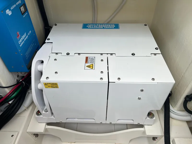 Slide: The Image of 2023 Tiara Yachts 38 LS engine compartment with electrical components and wiring. - 19