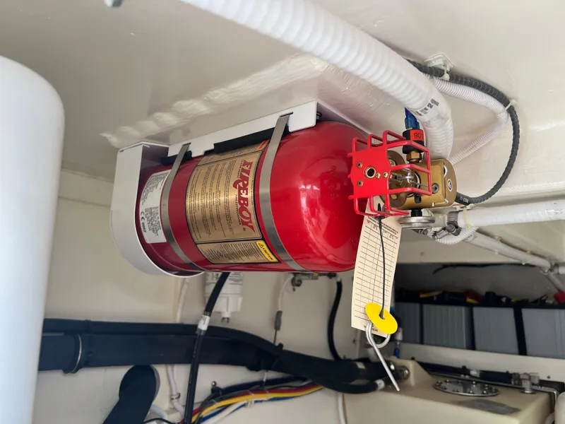 Slide: The Image of Fire extinguisher mounted in 2023 Tiara Yachts 38 LS engine room. - 22