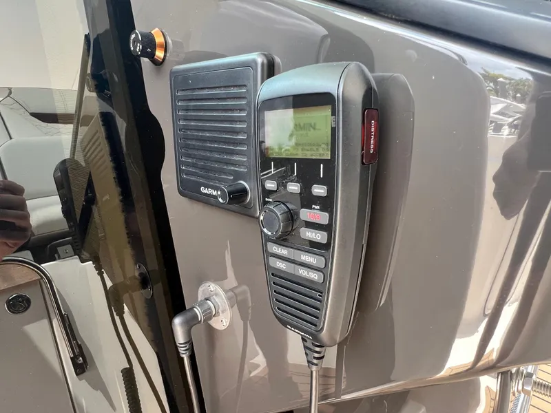 Slide: The Image of 2023 Tiara Yachts 38 LS featuring a Garmin marine radio and speaker system. - 33