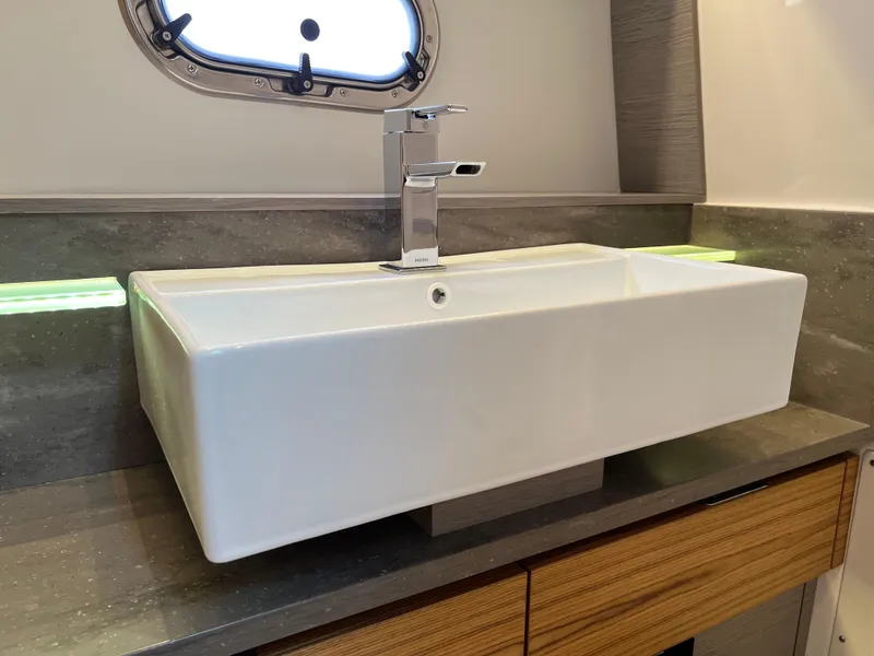 Slide: The Image of Modern bathroom sink in 2023 Tiara Yachts 38 LS, featuring sleek design and chrome faucet. - 40