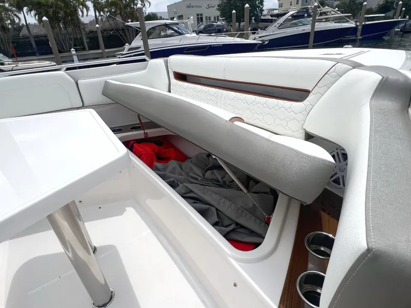 Slide: The Image of 2023 Tiara Yachts 38 LS interior with open storage compartment and seating. - 47