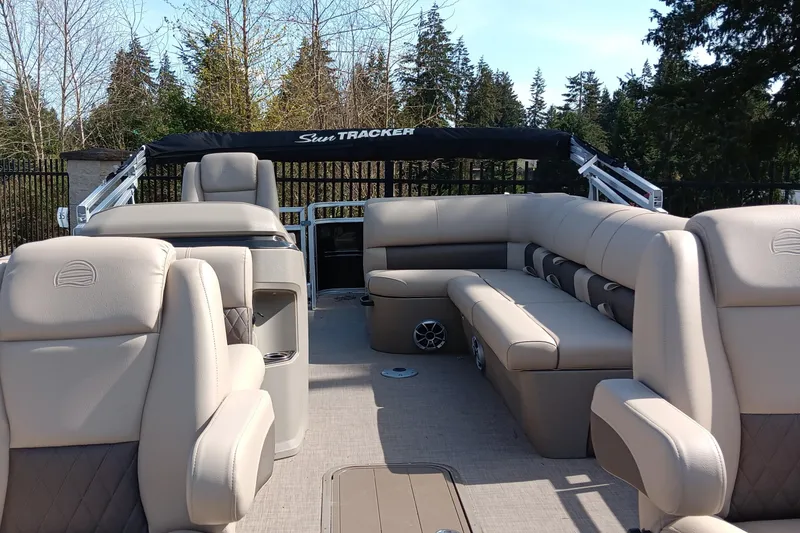 Slide: The Image of 2025 Sun Tracker Sportfish 24 XP3 pontoon boat with spacious seating and elegant design. - 3