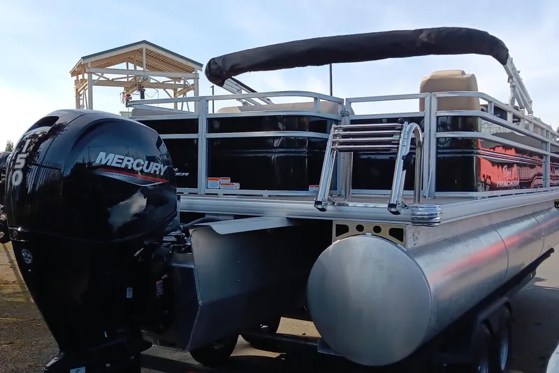 Slide: The Image of 2025 Sun Tracker Sportfish 24 XP3 pontoon boat with Mercury outboard motor. - 4