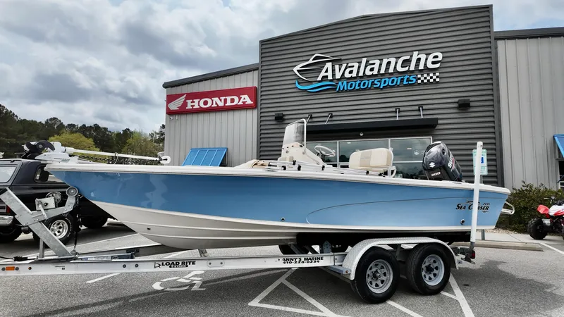 Slide: The Image of 2018 Sea Chaser LX 21 boat on trailer at Avalanche Motorsports dealership. - 1