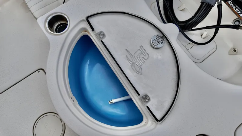 Slide: The Image of 2018 Sea Chaser LX 21 boat livewell with blue interior and secure lid. - 10