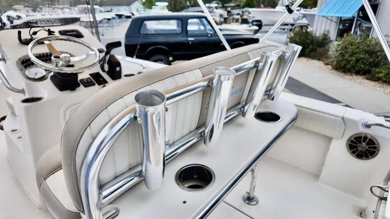 Slide: The Image of 2018 Sea Chaser LX 21 boat interior with rod holders and steering console. - 14