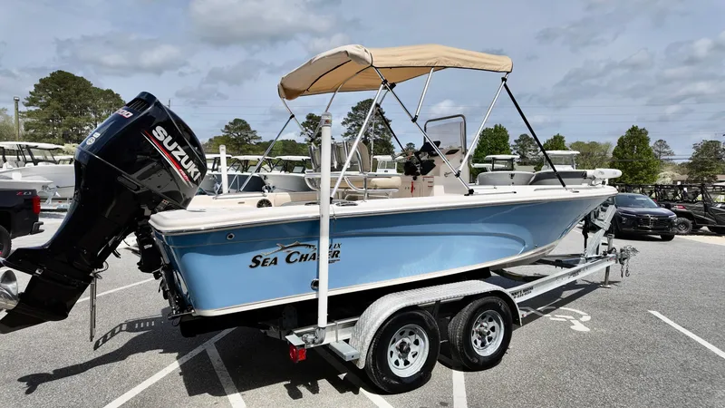 Slide: The Image of 2018 Sea Chaser LX 21 boat with Suzuki outboard motor on trailer. - 16