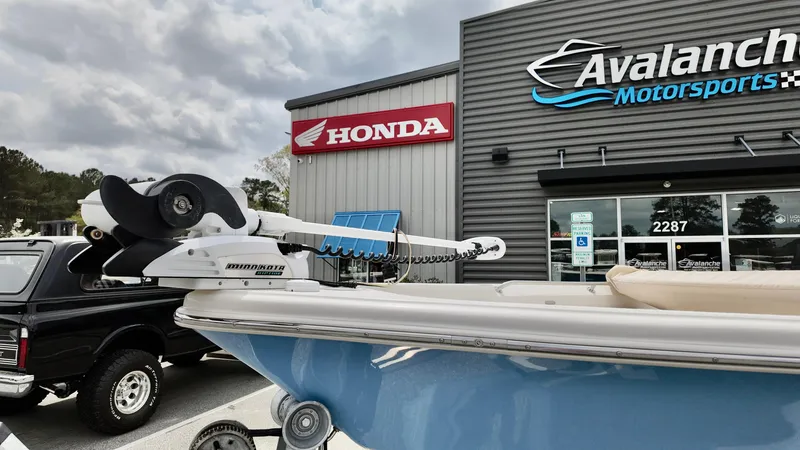 Slide: The Image of 2018 Sea Chaser LX 21 boat outside Avalanche Motorsports and Honda dealership. - 2