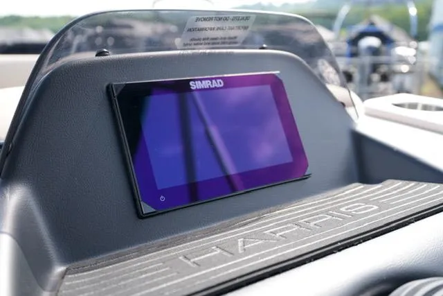 Slide: The Image of 2025 Harris Cruiser 230 dashboard with Simrad display, showcasing modern navigation technology. - 15