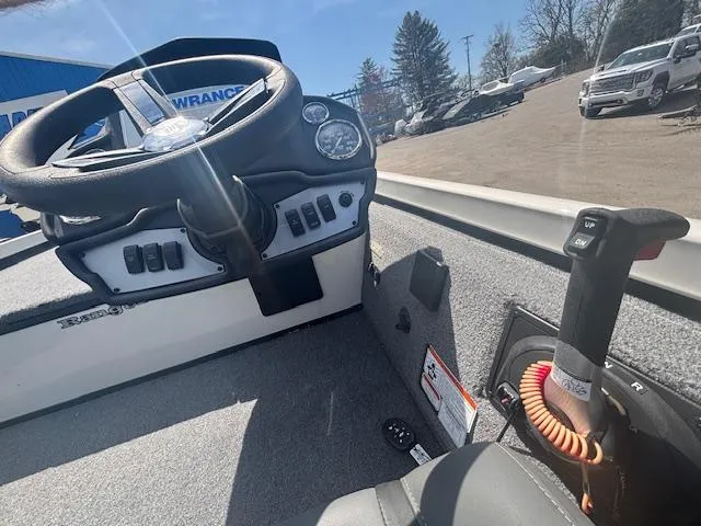 Slide: The Image of 2024 Ranger RT188 boat cockpit with steering wheel and control panel. - 12