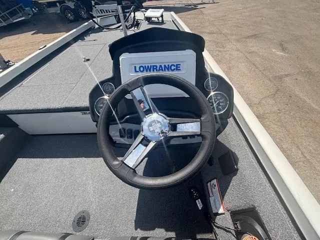 Slide: The Image of 2024 Ranger RT188 boat dashboard with Lowrance electronics and steering wheel. - 13