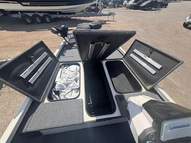 Slide: The Image of 2024 Ranger RT188 boat with open storage compartments and Lowrance equipment. - 18