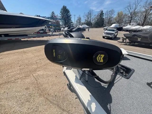 Slide: The Image of 2024 Ranger RT188 boat with Minn Kota trolling motor in a marina setting. - 23