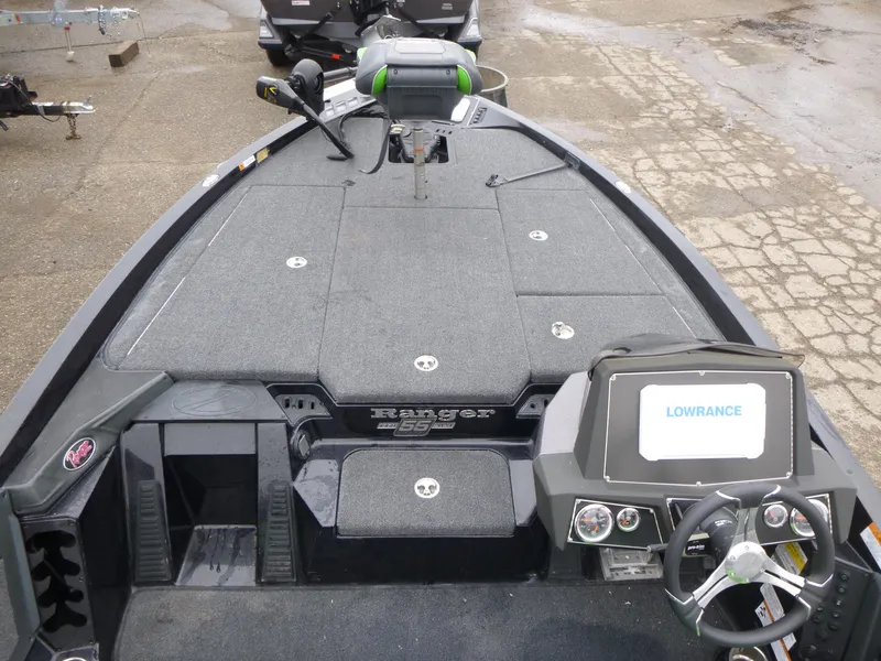 Slide: The Image of 2023 Ranger Z518 boat interior with Lowrance electronics and spacious deck layout. - 4
