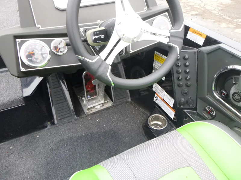 Slide: The Image of 2023 Ranger Z518 boat cockpit with steering wheel and control panel. - 5
