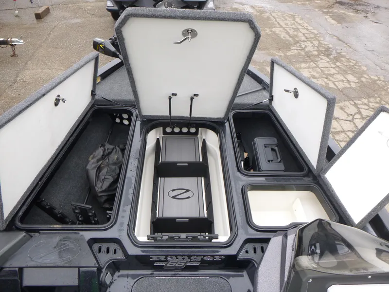 Slide: The Image of 2023 Ranger Z518 boat storage compartments open, showcasing organized interior layout. - 6