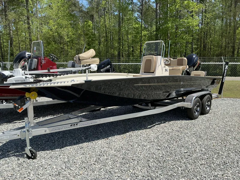 Slide: The Image of 2025 Xpress Hyper-Lift Series H22B boat with Terrova and stereo on trailer. - 1