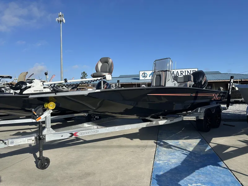 Slide: The Image of 2025 Xpress Hyper-Lift Series H22B boat on trailer, outdoor display. - 1