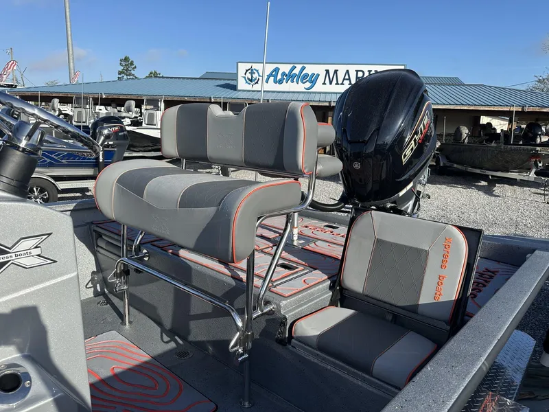 Slide: The Image of 2025 Xpress Hyper-Lift Series H22B boat with seating and motor at Ashley Marine. - 3