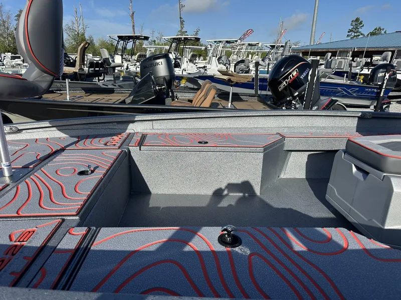 Slide: The Image of 2025 Xpress Hyper-Lift Series H22B boat interior with stylish red accents. - 6