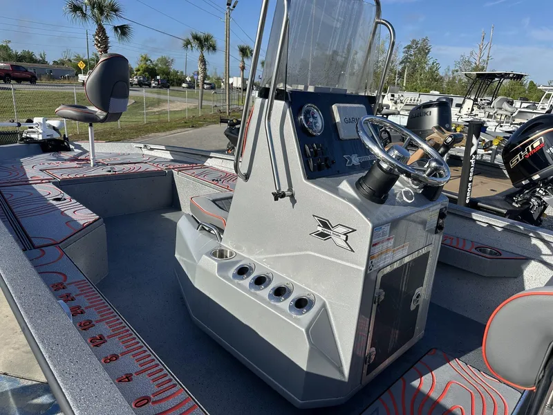 Slide: The Image of 2025 Xpress Hyper-Lift Series H22B boat interior with steering console and seating. - 8