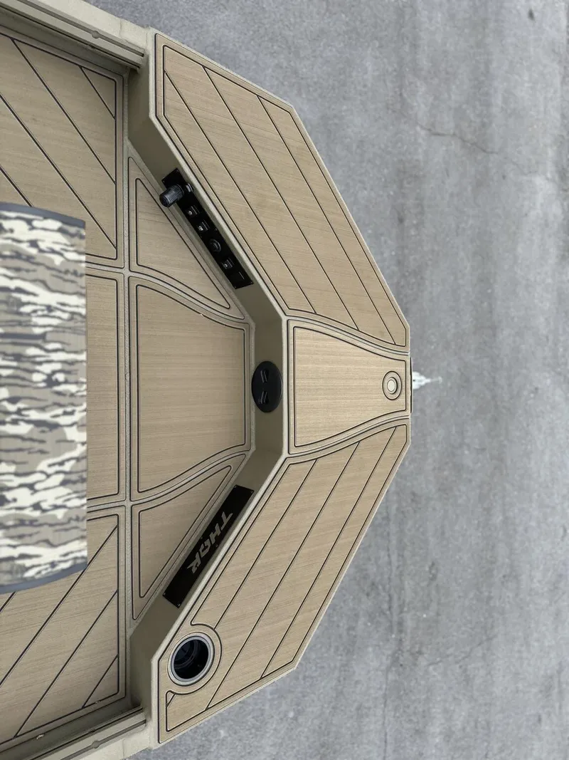 Slide: The Image of 2025 Thor LAKE HAMMER 1900 CC boat deck, featuring sleek wood finish and modern design. - 3