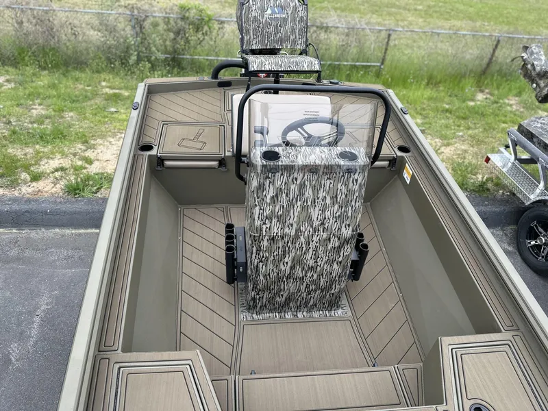 Slide: The Image of 2025 Thor LAKE HAMMER 1900 CC boat interior with camouflage seating and steering console. - 8