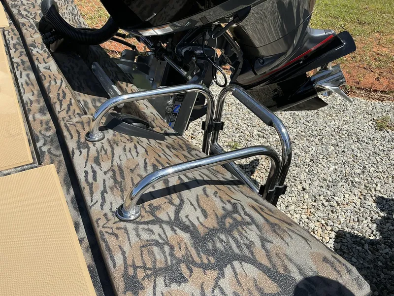 Slide: The Image of 2025 Xpress Hyper-Lift Crappie Series H20 boat with camo pattern and motor detail. - 8