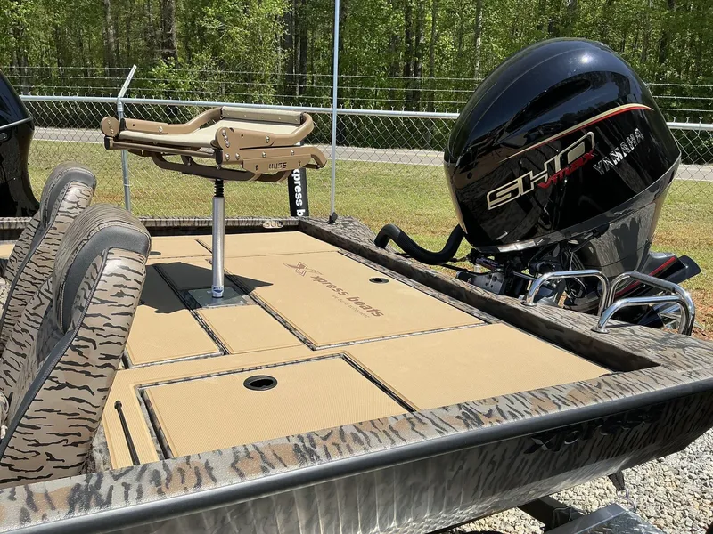 Slide: The Image of 2025 Xpress Hyper-Lift Crappie Series H20 boat with Yamaha motor, camo seats, and deck. - 3