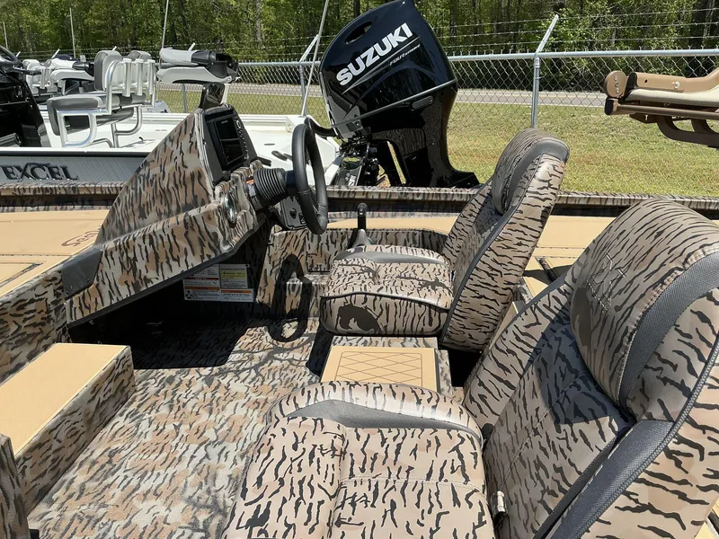 Slide: The Image of 2025 Xpress Hyper-Lift Crappie Series H20 boat with camo interior and Suzuki engine. - 4