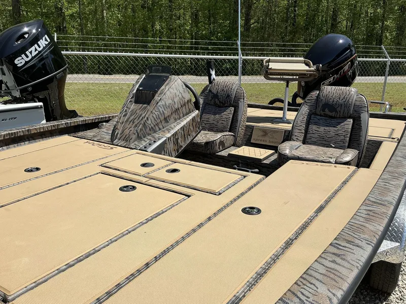 Slide: The Image of 2025 Xpress Hyper-Lift Crappie Series H20 boat with Suzuki motor, featuring camo seats and spacious deck. - 7