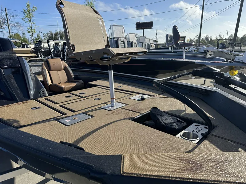 Slide: The Image of 2025 Xpress Hyper-Lift Series H18 Crappie Model boat with tan seating and deck. - 3