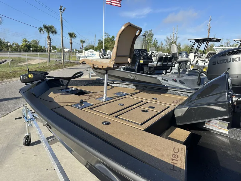 Slide: The Image of 2025 Xpress Hyper-Lift Series H18 Crappie Model boat on trailer, outdoor setting. - 7