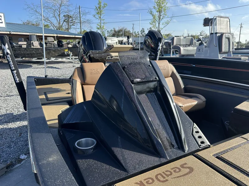 Slide: The Image of 2025 Xpress Hyper-Lift Series H18 Crappie Model boat with tan seats and sleek design. - 9