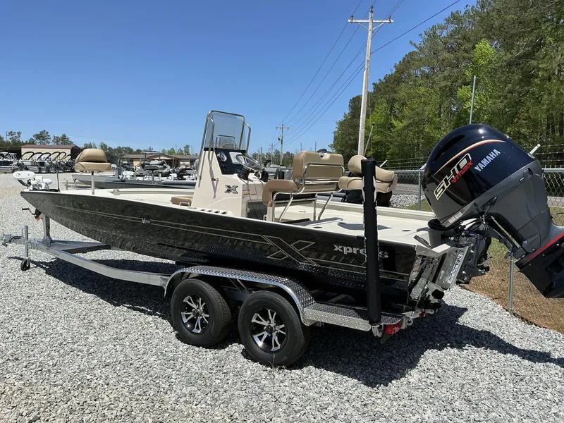 Slide: The Image of 2025 Xpress Hyper-Lift Series H22B boat with Terrova, stereo, and Yamaha engine on trailer. - 6