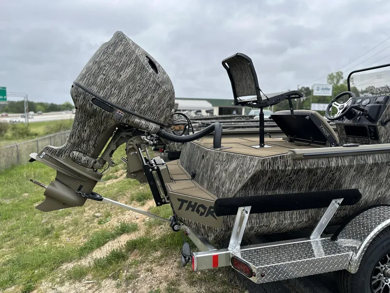 Slide: The Image of 2025 Thor LAKE HAMMER 1900 CC boat with camo design and powerful outboard motor. - 4
