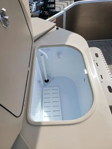 Slide: The Image of Livewell compartment on 2023 Godfrey Sweetwater SW2286F boat, featuring a clean, spacious interior. - 6