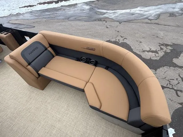 Slide: The Image of 2025 Harris CRUISER 230 SLDH boat seating with tan and gray upholstery. - 11