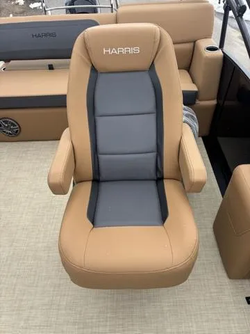 Slide: The Image of 2025 Harris CRUISER 230 SLDH boat seat, tan and gray upholstery, luxurious design. - 12