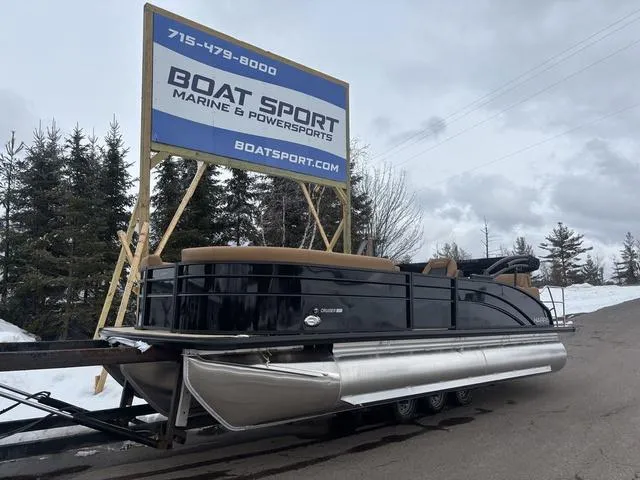 Slide: The Image of 2025 Harris CRUISER 230 SLDH pontoon boat at Boat Sport dealership in snowy setting. - 2
