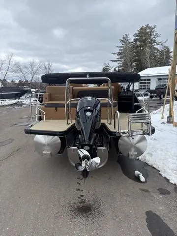 Slide: The Image of 2025 Harris CRUISER 230 SLDH pontoon boat with outboard motor, parked on snowy pavement. - 7