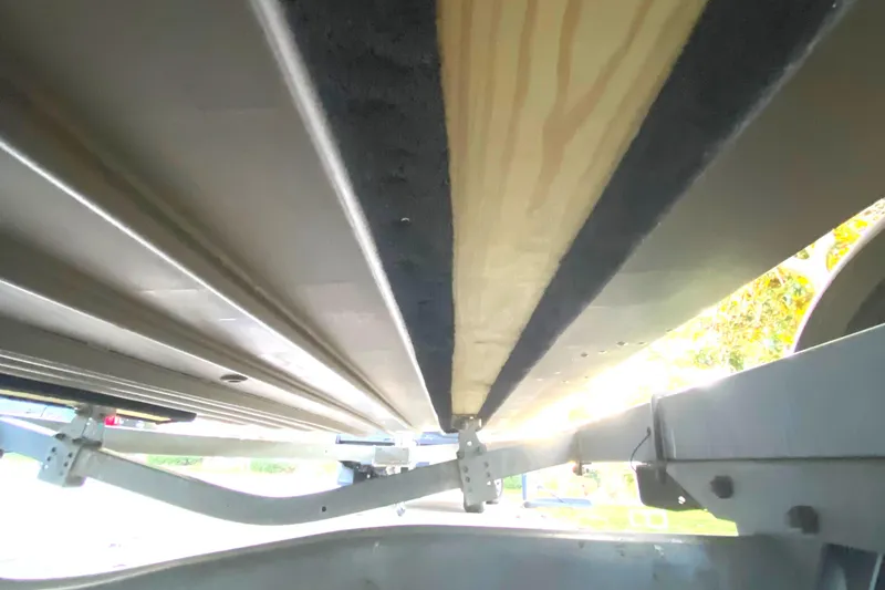 Slide: The Image of Underneath view of a 2007 G3 1966 CC boat on a trailer. - 4
