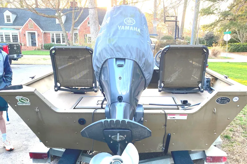 Slide: The Image of Boat with Yamaha motor, G3 1966 CC model, parked in residential area. - 9