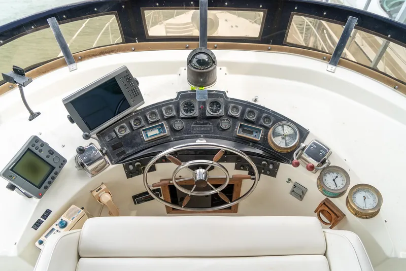 Slide: The Image of Cockpit of 1985 Bluewater 46 Motor Yacht with navigation instruments and steering wheel. - 7