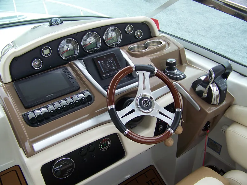 Slide: The Image of Helm of 2020 Crownline 350 SY boat with modern controls and steering wheel. - 10
