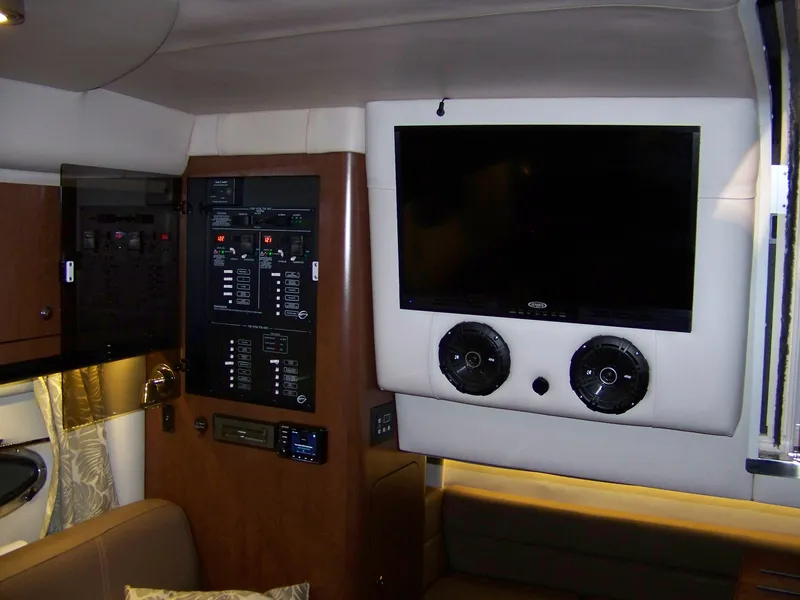 Slide: The Image of Interior of 2020 Crownline 350 SY yacht with control panel and mounted TV. - 25